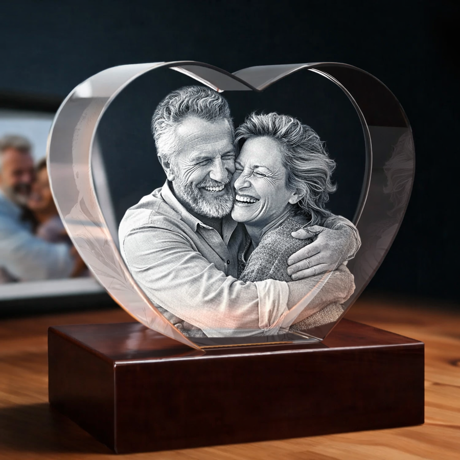 Personalized heart-shaped 3D crystal photo of a coaple, displayed on a black LED light base
